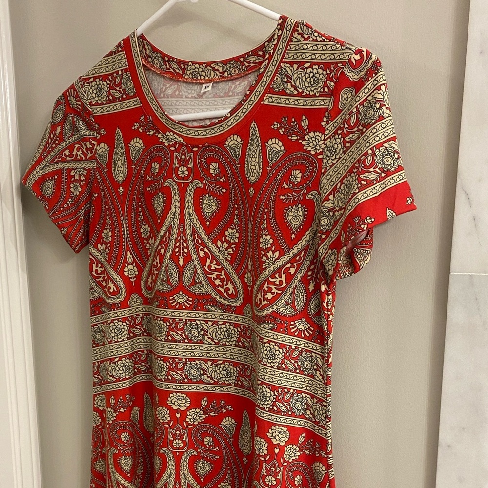 Tshirt dress.  Flared skirt.  Poly spandex. Great run around or travel dress!